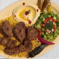 Filet Kabob · Filet mignon with rice, hummus and salad