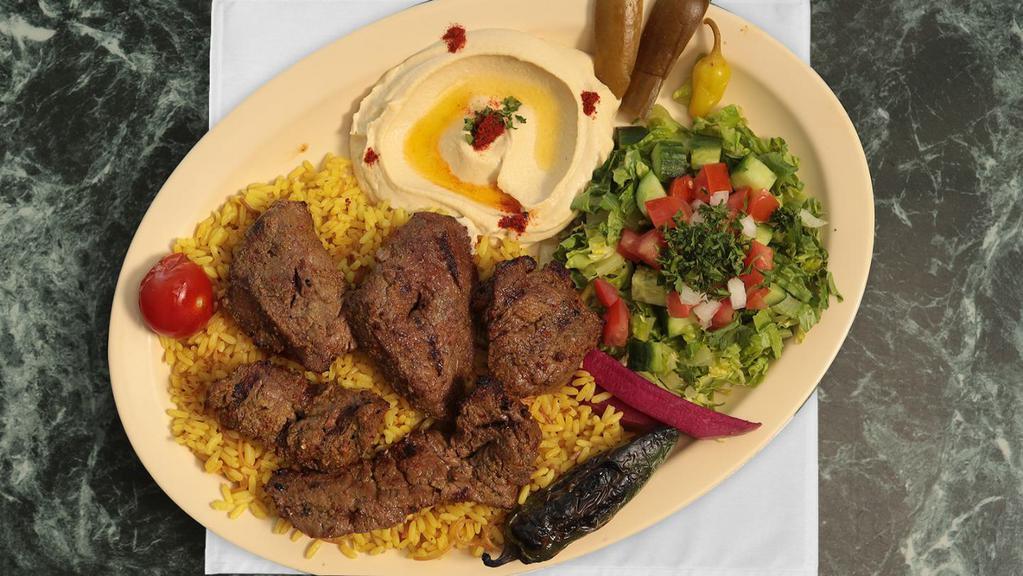 Filet Kabob · Filet mignon with rice, hummus and salad