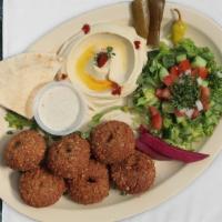 Falafel Plate · Vegetarian. Served with syrian salad, hummus and homemade pickles.