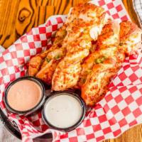 Spicy Garlic Twist · Jalapenos, onions, hot sauce & cheese topped with mozzarella and served with spicy Ranch dre...