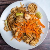 Pad Thai · Rice noodles with shrimp and chicken, egg, scallions, tofu, and bean sprouts. Served with cr...