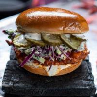 Buffalo Chicken Sandwich · country fried chicken breast tossed in buffalo sauce, slaw, lemon-herb mayo, pickles, brioch...