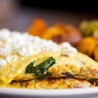 Shrimp Omelet · Shrimp, spinach, tomatoes, onion, feta and jack. Topped with hollandaise sauce.
