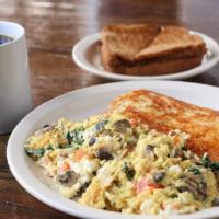 Zorbas Scramble · Two eggs scrambled with spinach, mushrooms, tomatoes and feta cheese. served with choice of ...