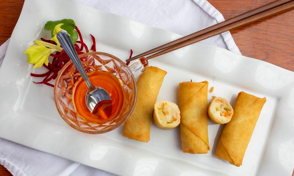 Egg Rolls · Fried vegetarian rolls of cabbage, celery, carrot,glass noodle served with sweet and sour sauce.