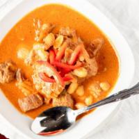 Mussamun · Southern style Thai red curry with steak sliced and simmered in coconut milk. * 
 
*Medium.