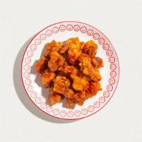 Orange Chicken · Lightly battered, chicken, scallions, onions, and sun-dried chili pepper wok-toseed in a swe...
