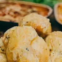 Garlic Knots (Delivery) · strips of pizza dough tied in a knot, baked and then topped with melted butter, garlic and p...