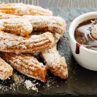 Churros · Fried pastry dusted with cinnamon sugar.