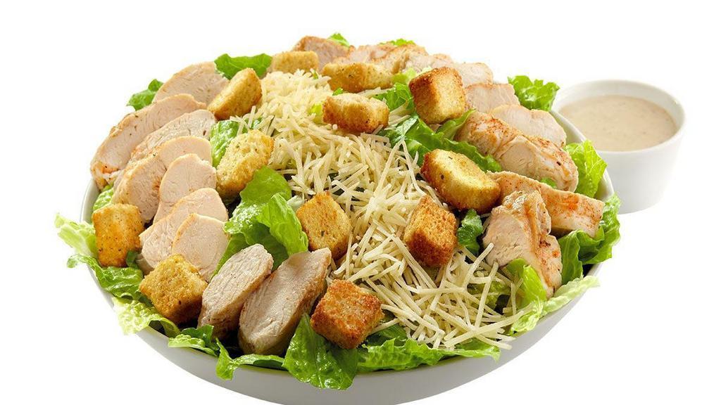 Chicken Caesar Salad · The Classic Caesar of romaine lettuce, parmesan and croutons topped with tender chicken strips.  Pair with our Caesar dressing or pick from our list of dressing options.