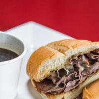 French Dip · Grilled roast beef served on a warm French roll with melted Swiss and a cup of hot au jus fo...