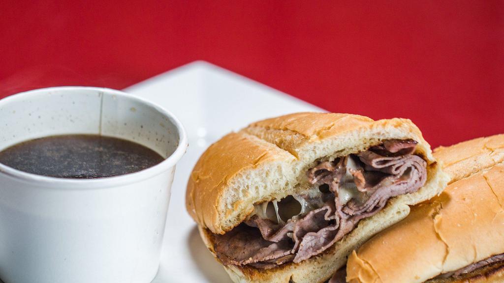 French Dip · Grilled roast beef served on a warm French roll with melted Swiss and a cup of hot au jus for dipping.