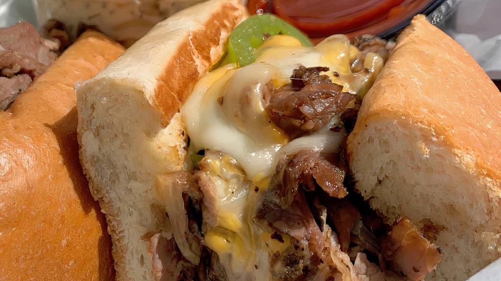 Philly Cheesesteak · A full half-pound of the best-chopped sirloin served hot with melted baby Swiss cheese on a soft, warm French roll. Topped with grilled onions, mushrooms and green peppers (optional).
