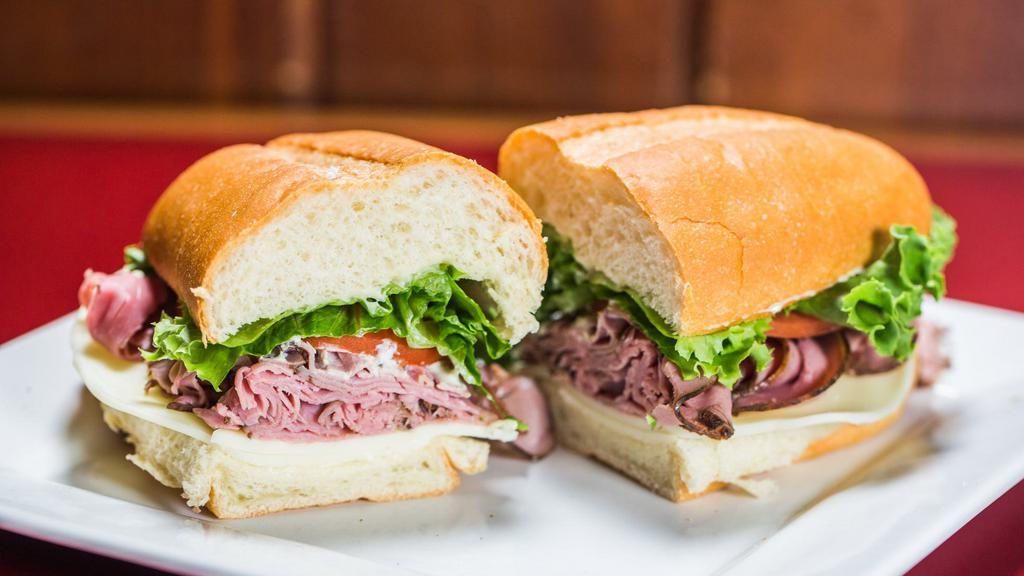 Roast Beef · Medium rare shaved top round of beef, sliced thin with Provolone cheese, fresh lettuce, tomato, mayo, and our special horseradish sauce. Served on a soft french roll.