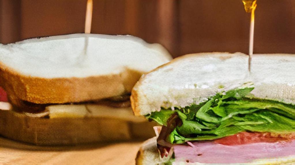 Ham & Baby Swiss · Served on sourdough with lettuce, tomato, and honey mustard.