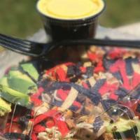 Southwestern Chicken Salad · Mildly spicy grilled chicken on a garden salad with tortilla chips, avocado, Pepper-Jack che...