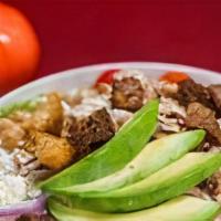 California Chicken Salad · Marinated grilled chicken on a garden salad with avocado, Feta cheese, and garbanzo beans. C...