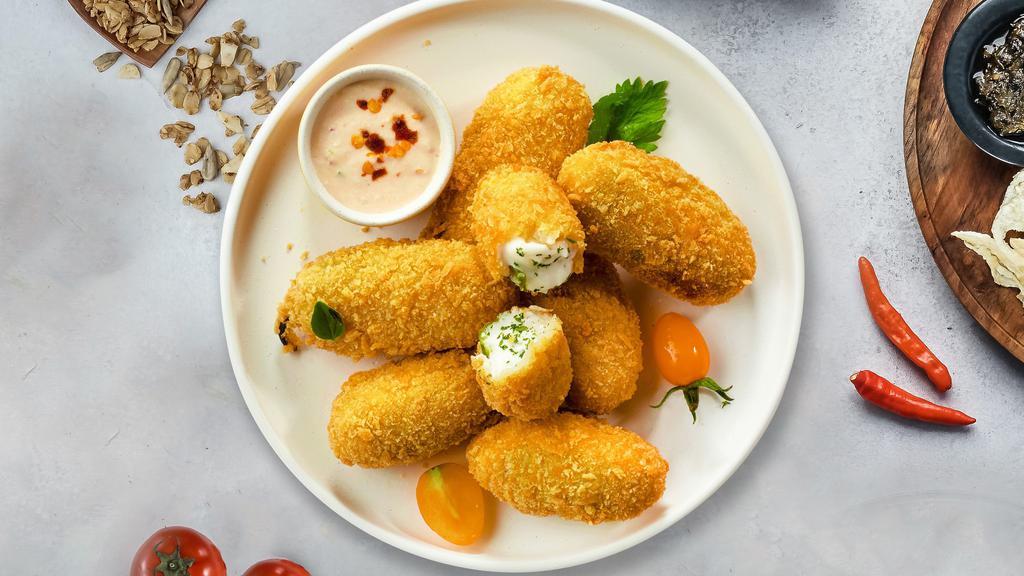 Holy Jalapeño Poppers · (Vegetarian) Fresh jalapenos coated in cream cheese and fried until golden brown.