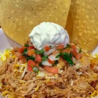 Fiesta Bowl · Served with pinto beans, Spanish rice, cheese, pico de gallo, sour cream, and our super Mex ...