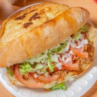 Tortas · Bolillo bread sandwich topped with your choice of meat, refried beans, lettuce, jalapeños, t...