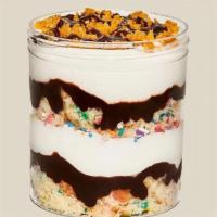 Build-A-Pint · A layered pint of ice cream with Cereal Milk Soft Serve and your choice of cake, sauce and t...