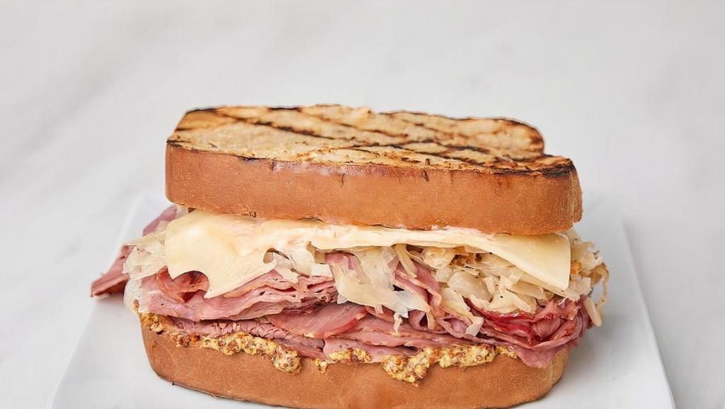 Reuben Ny Style · Jack's Reuben is NY Style with lean corned beef, swiss cheese, sauerkraut, russian dressing, and whole grain mustard on thick-cut rye bread.