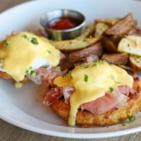 'Traditional' Biscuit Benedict · Black Forest ham, poached eggs, and hollandaise on a house-made white cheddar biscuit with '...