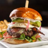 Steakhouse Burger · Aged white cheddar, arugula, tomato, pickled red onions, aioli.