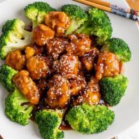 Sesame Chicken · Served with sesame seeds with broccoli and white rice.