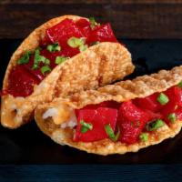 Spicy Tuna Taco · Tuna, Ponzu mayo, sushi rice and green onions in a Gyoza shell. Order comes with two tacos.