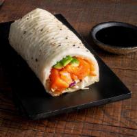 Salmon Sushirrito · Salmon, Kumi coleslaw, Cucumber, miso vinegar, sesame seeds and sushi rice wrapped in soy pa...