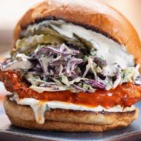 Buffalo Chicken Sandwich · country fried chicken breast tossed in buffalo sauce, slaw, lemon-herb mayo, pickles, brioch...