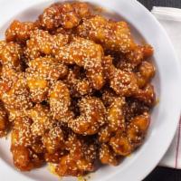 Sesame Chicken (Dark Meat) · Lightly battered chicken in our chef's special sesame sauce. Topped with sesame seeds.