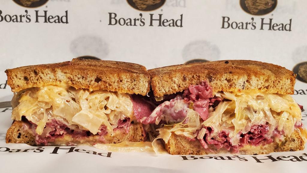 Classic Reuben · Corned Beef, Melted Swiss Cheese, Grilled Sauerkraut, and Creamy Thousand Island Dressing on Toasty Marbled Rye.