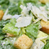 Caesar Salad · Romaine Lettuce Tossed w/ Croutons, Caesar Dressing & topped with Parmesan Cheese