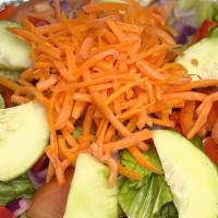 Garden Salad · Fresh Lettuce, Tomatoes, Cucumbers, Peppers, Onions, Carrots & House Dressing On The Side