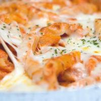 Baked Ziti W/ Ricotta · Fresh penne pasta baked with ricotta cheese, red sauce, parmesan, and mozzarella cheese.