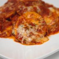 Baked Ravioli W/ Mozzarella · Fresh baked cheese-filled ravioli in our red marinara sauce and baked with mozzarella cheese.