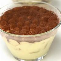 Tiramisu · Sponge cake soaked in espresso, topped with mascarpone cream and dusted with cocoa powder