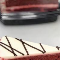 Red Velvet Cake  · A red hued chocolate layer cake, filled and iced wtih a smooth cream cheese frosting, finish...