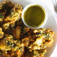 Assorted Pakora · A sampler platter of veggies coated with chickpea batter and fried.