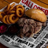 Tri-Tip Sandwich · Our Pitmaster’s specialty sandwich is piled high with slow smoked Cali BBQ Tri-Tip and serve...