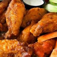 Wings (10Pc) · 10 Fresh bone in chicken wings with our specialty dry rub, choice of one sauce, served with ...