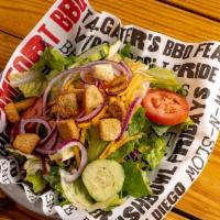 Lrg House Salad · Salad mix topped with cucumber, tomato, red onion, shredded cheddar and seasoned croutons.