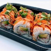 Lion King Roll (Non-Raw) · Inside: Crab Salad, Avocado.
On top: Salmon (baked), Masago, Green Onions.
Sauce: Spicy Mayo...