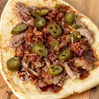 Angry Piggy · Smoky pulled pork over melty jack cheese with SPICY BBQ sauce, bacon pieces and pickled jala...