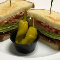 Turkey Club · Turkey, bacon, avocado, swiss cheese, lettuce, tomatoes, onion and mayonnaise and mustard.