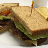 Roast Beef · Roast beef, swiss cheese, lettuce, tomatoes, onion and mustard and mayonnaise.