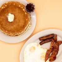 Pancake Breakfast · 3 fluffy pancakes, 3 eggs, and choice of bacon, sausage, or ham.