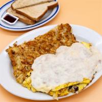Country Omelette · Eggs, mushrooms, onions, sausage, and Swiss cheese covered with a country-style gravy. Comes...